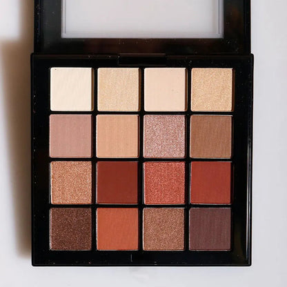 Close-up view of warm neutral eye shadow shades in palette