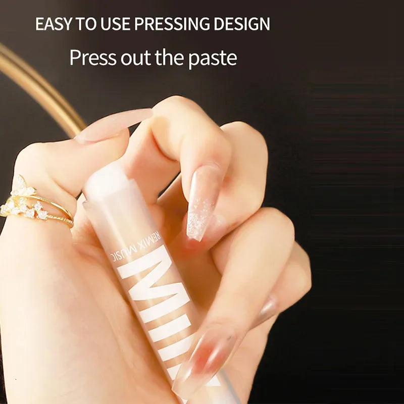 Close-up view of concealer being applied to skin