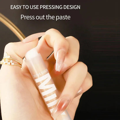 Close-up view of concealer being applied to skin