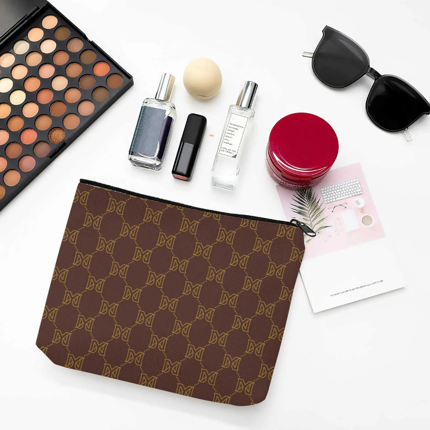 Side profile of makeup bag placed next to a purse for size comparison