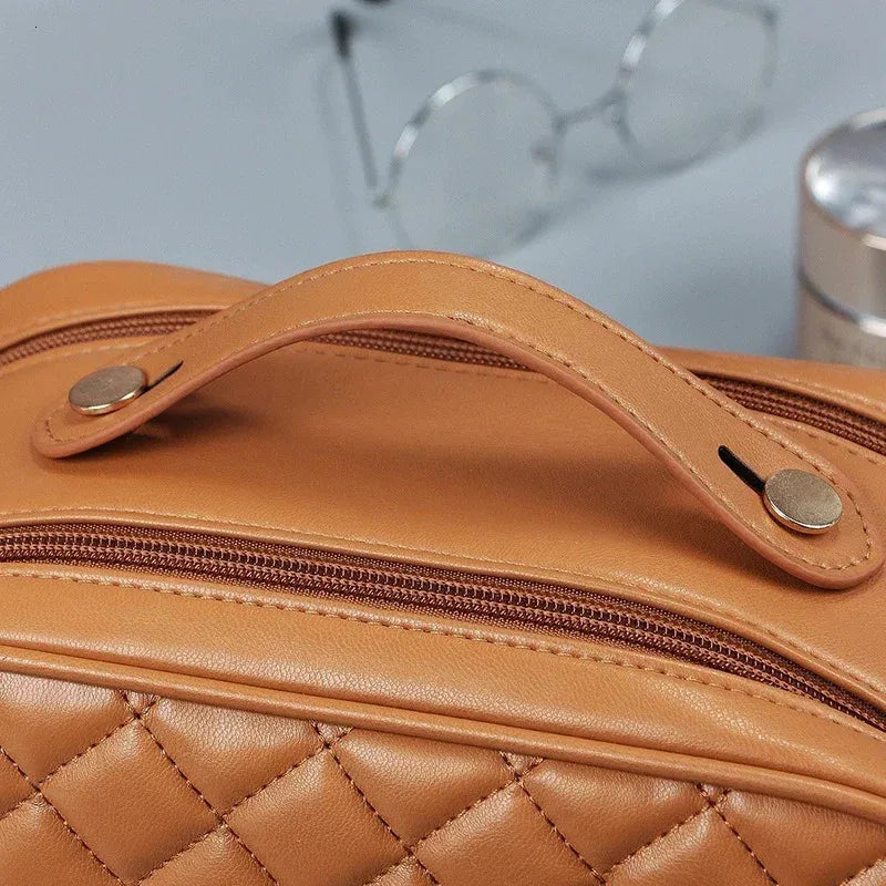 Front view of a portable makeup bag in a neutral color
