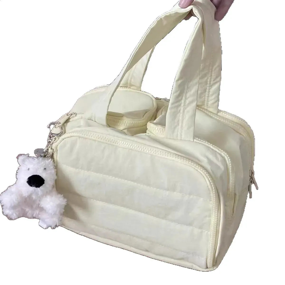 Front view of a portable makeup bag with four openings