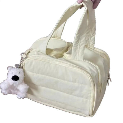 Front view of a portable makeup bag with four openings