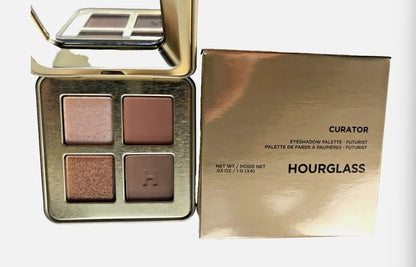 Quad eyeshadow palette showing four pressed powder shades with metallic finish
