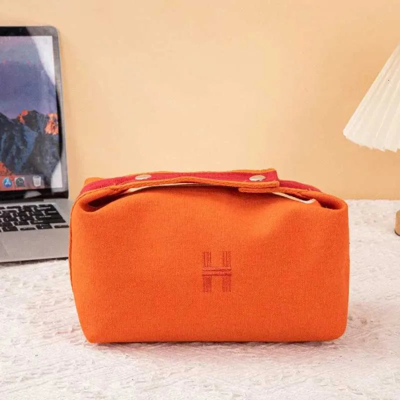 Portable travel cosmetic bag in beige white color