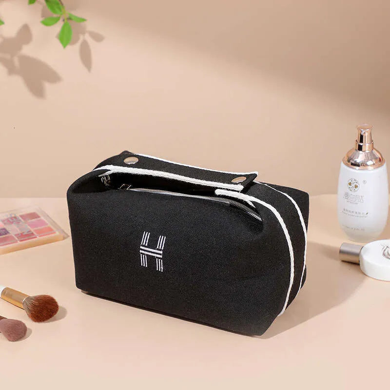 Handheld makeup bag in blue color with Japanese-style aesthetic