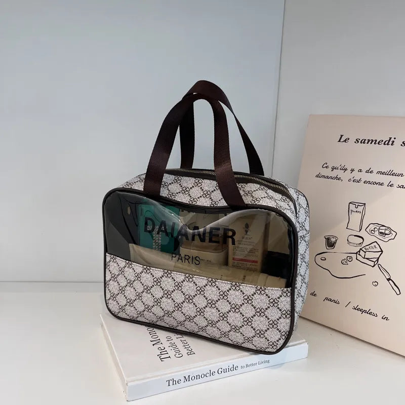 Portable toiletry bag in neutral color with structured compartments visible