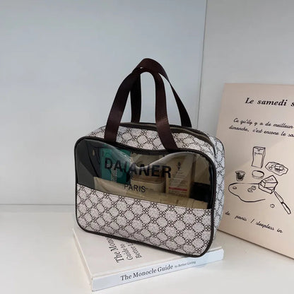 Portable toiletry bag in neutral color with structured compartments visible