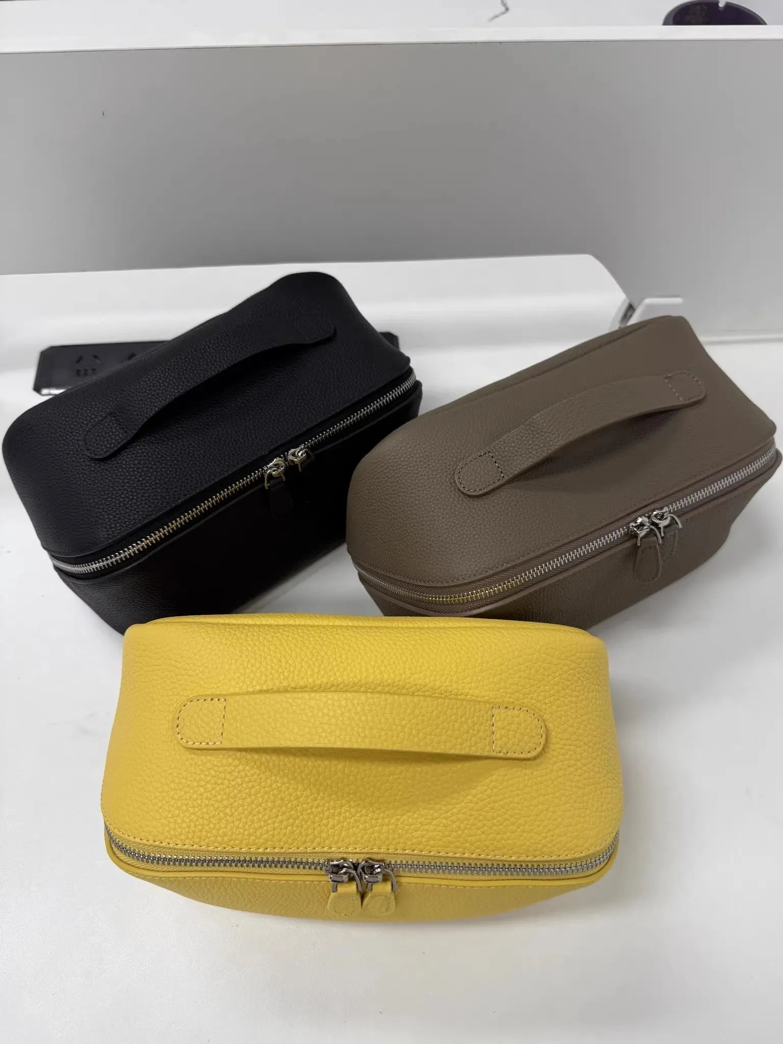 Top-grain leather cosmetic bag with 2026 texture pattern