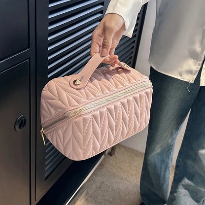 Front view of a PU cosmetic organizer bag with zipper closed