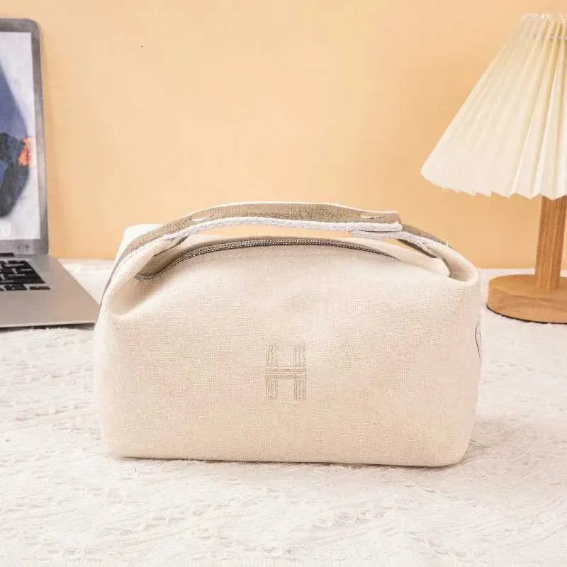 Cosmetic bag in sapphire blue color placed on a flat surface