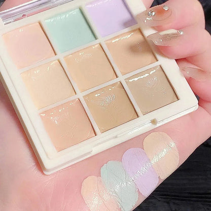 Close-up view of concealer shades being applied to skin with a makeup brush