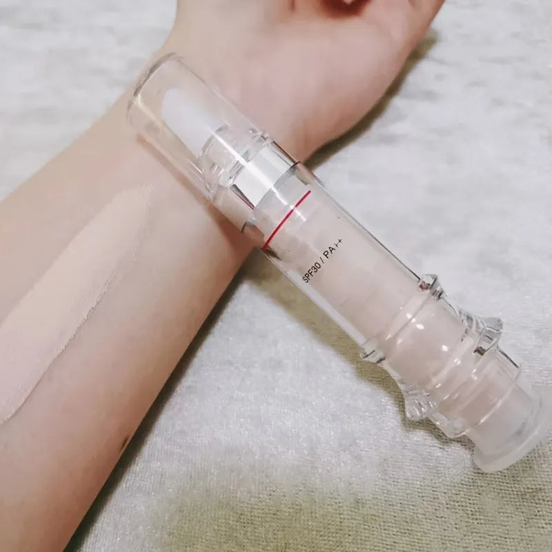 Liquid corrector product in spray bottle on neutral background