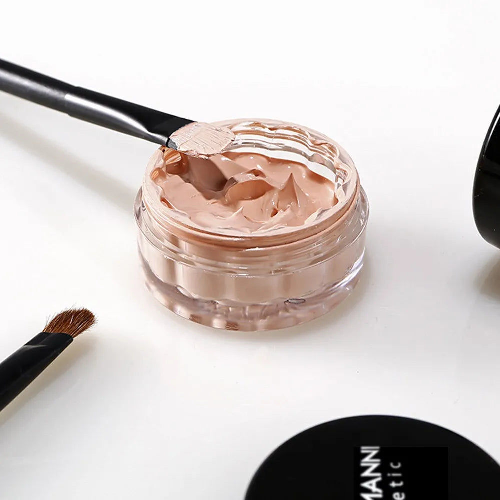 Liquid concealer cream in packaging with applicator