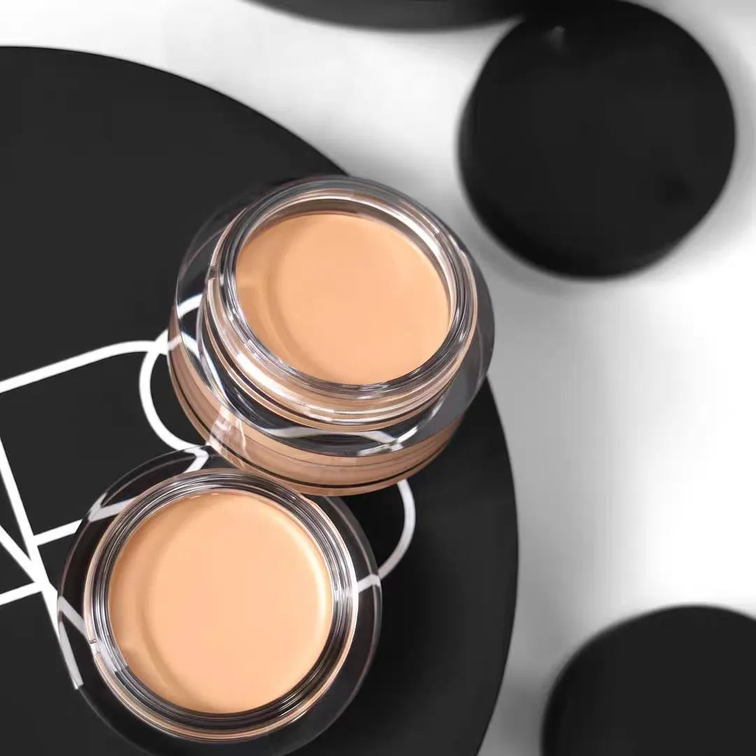 Close-up of concealer being applied to under-eye area