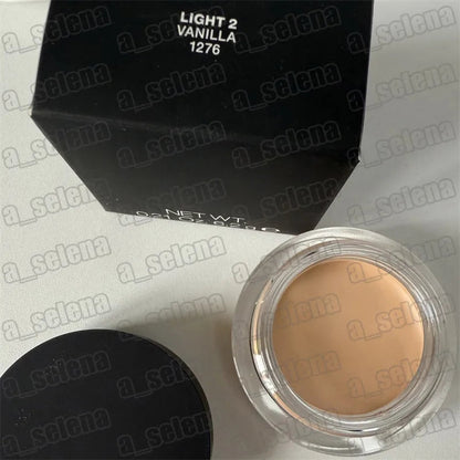 Makeup compact with four shade pans arranged in square formation