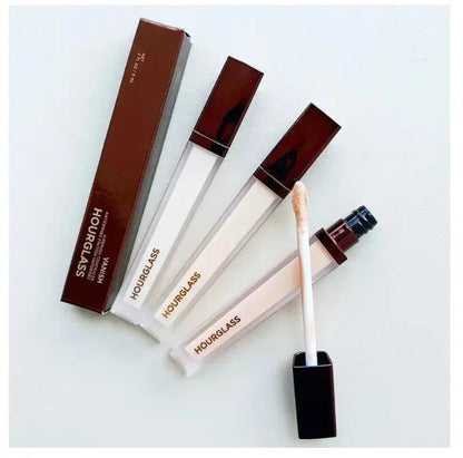 Eight shades of cream concealer displayed in individual containers