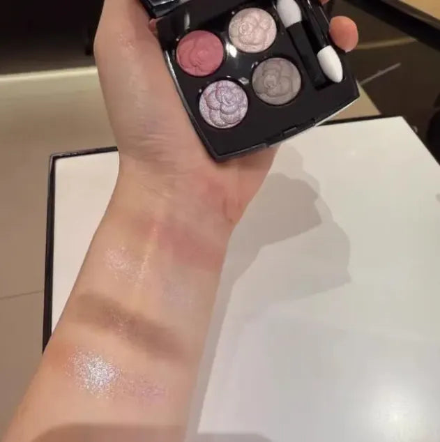 Four-color eyeshadow palette showing matte and shimmer shades