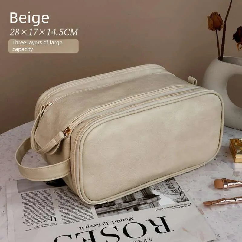 Multi-compartment makeup bag with open compartments showing interior organization