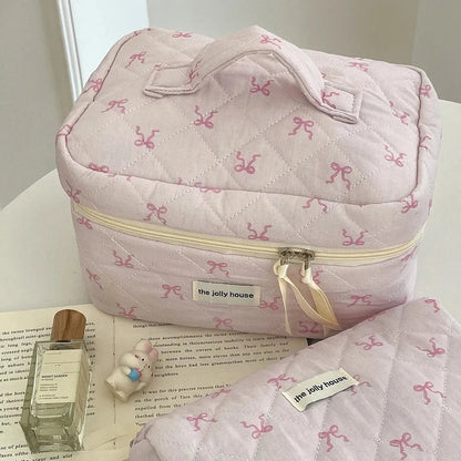 Cosmetic bag displayed next to personal care items for scale