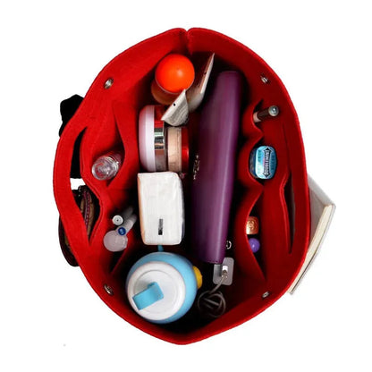 Makeup and toiletry items organized in felt storage insert