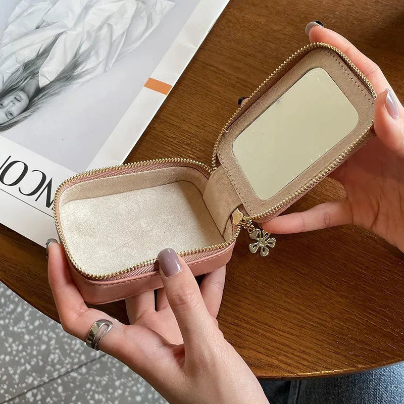 Compact leather lipstick bag with zipper closure shown closed