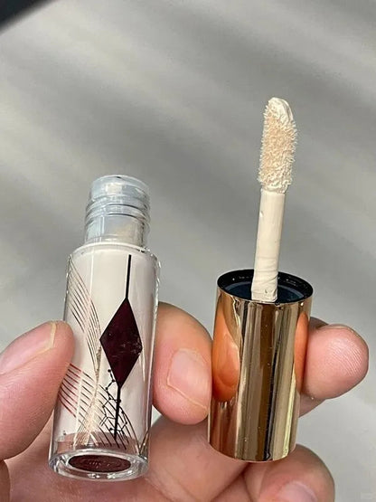 Liquid concealer sample tubes arranged on a neutral background