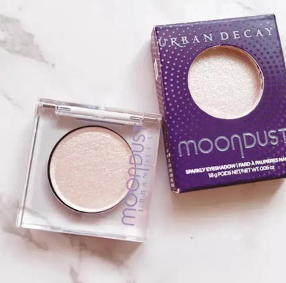 Four monochrome eyeshadow shades in a compact palette with mirror