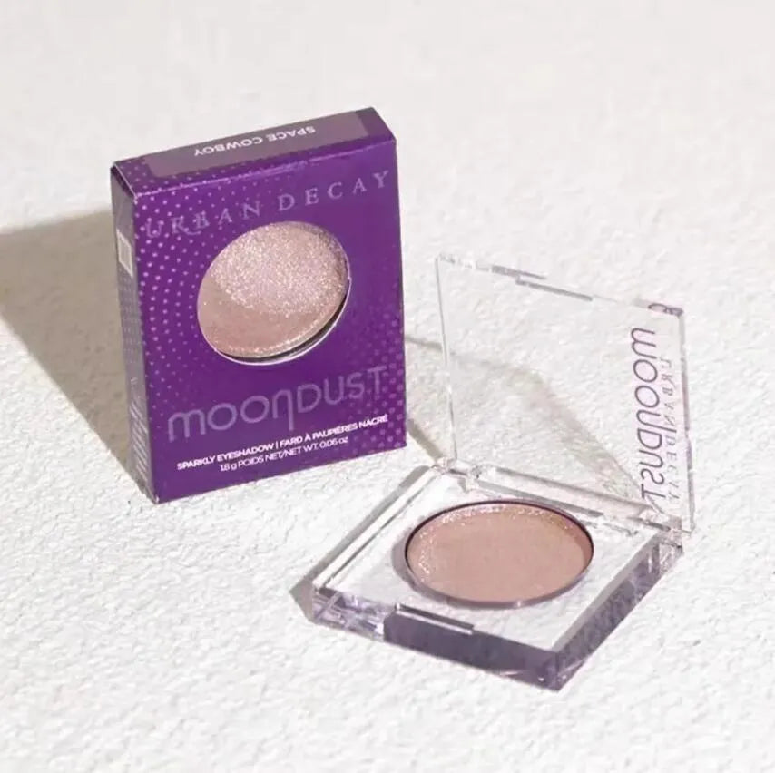 Four monochrome eyeshadow shades in a compact palette with mirror