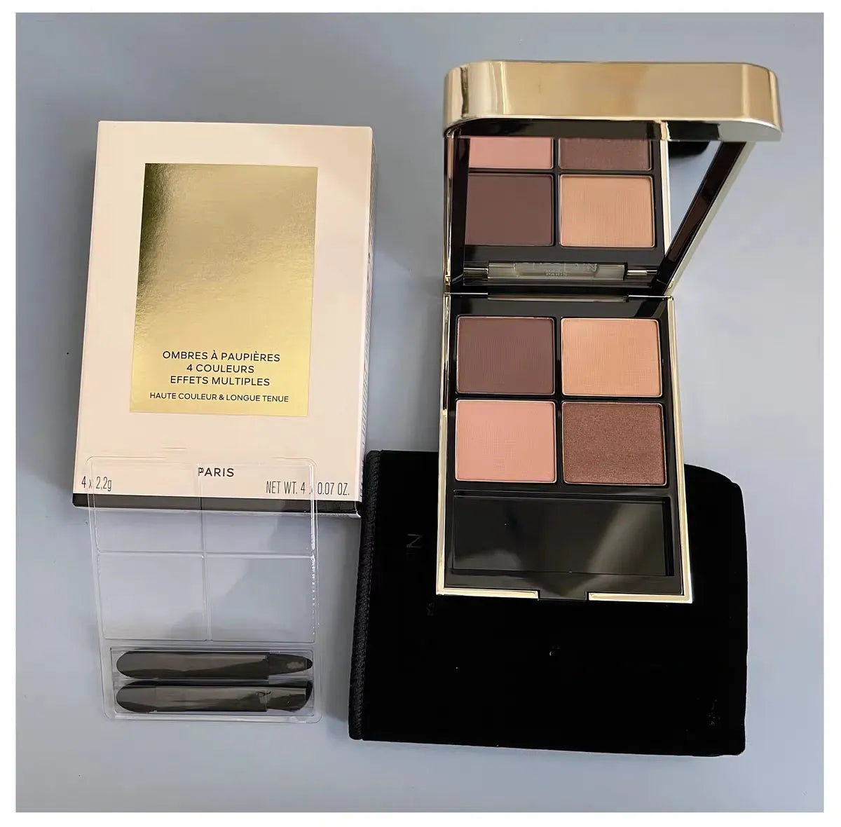 Waterproof eye shadow quad with shimmery pigment powder in open packaging