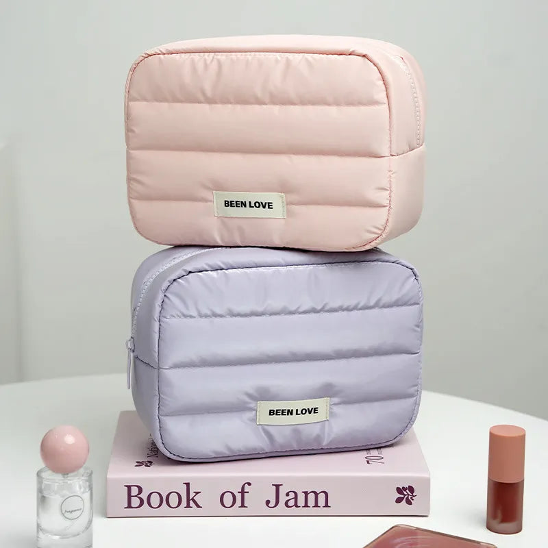 Front view of starry glow patterned makeup bag with handheld strap