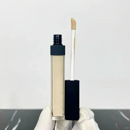 Creamy liquid concealer in a small tube with doe-foot applicator
