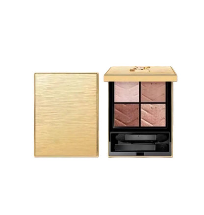 Compact eyeshadow palette with four color shades open on a surface