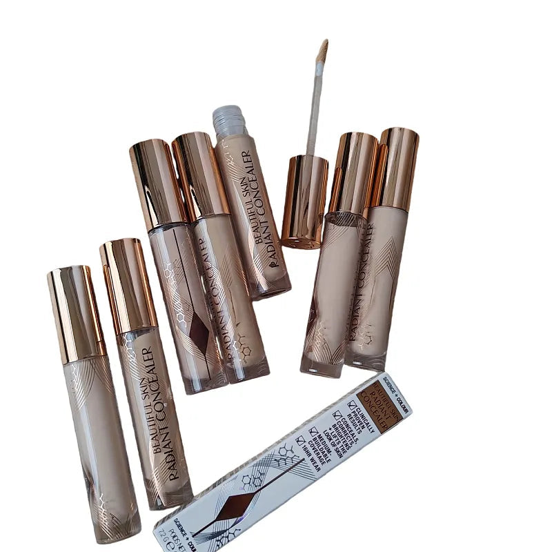 Close-up of concealer being applied to under-eye area with fingertip