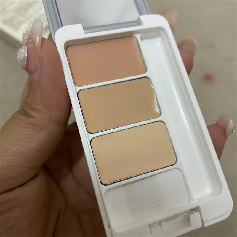 Close-up view of the three concealer shades in their individual wells