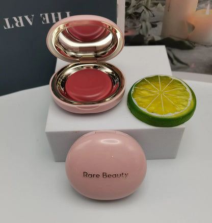 Close-up view of blusher cream texture and pigmentation