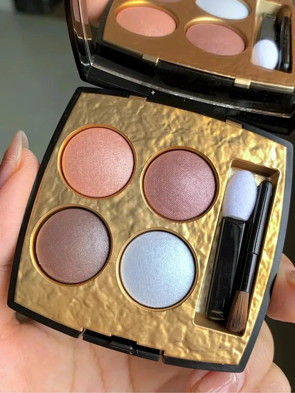 Quadra eyeshadow palette showing four coordinated color shades