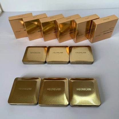 Close-up view of the four eyeshadow shades showing matte and shimmer textures