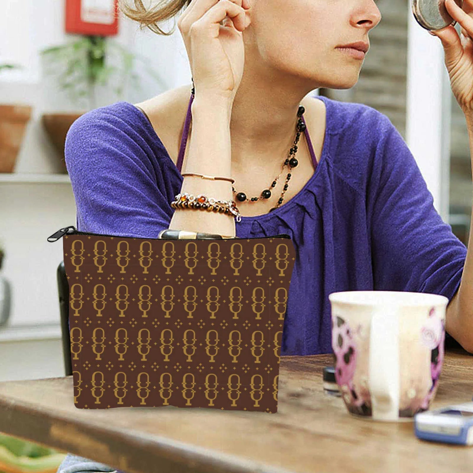 Side perspective of cosmetic bag demonstrating compact travel size