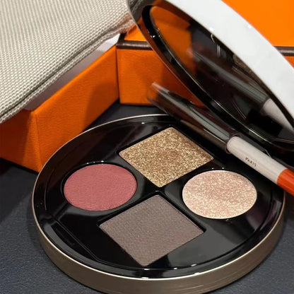 Eyeshadow palette displayed with application brush for makeup use
