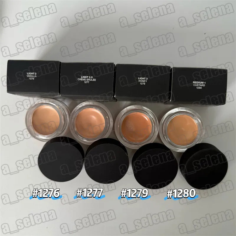 Makeup compact with four shade pans arranged in square formation