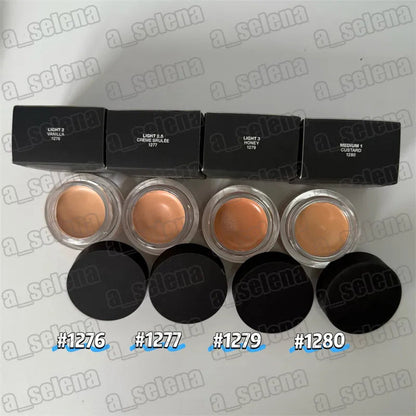Makeup compact with four shade pans arranged in square formation