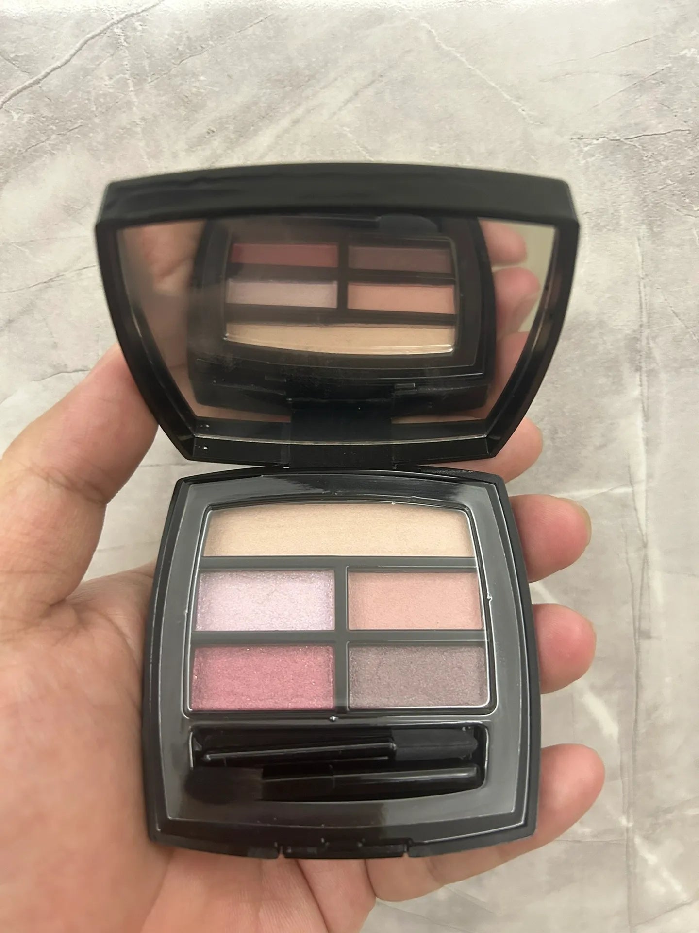 Professional eyeshadow palette with multiple shades in compact case