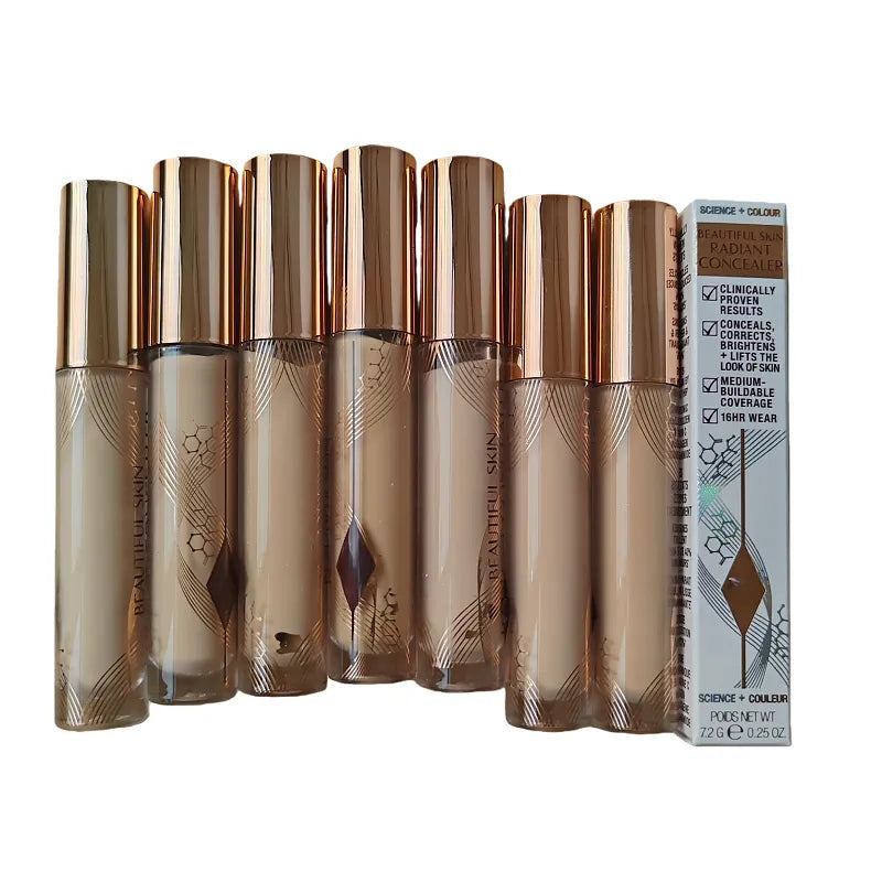 Liquid concealer in tube with doe-foot applicator on white background