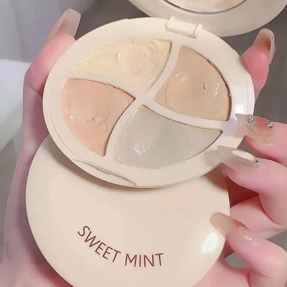 Open cosmetic palette showing multiple shades of concealer cream