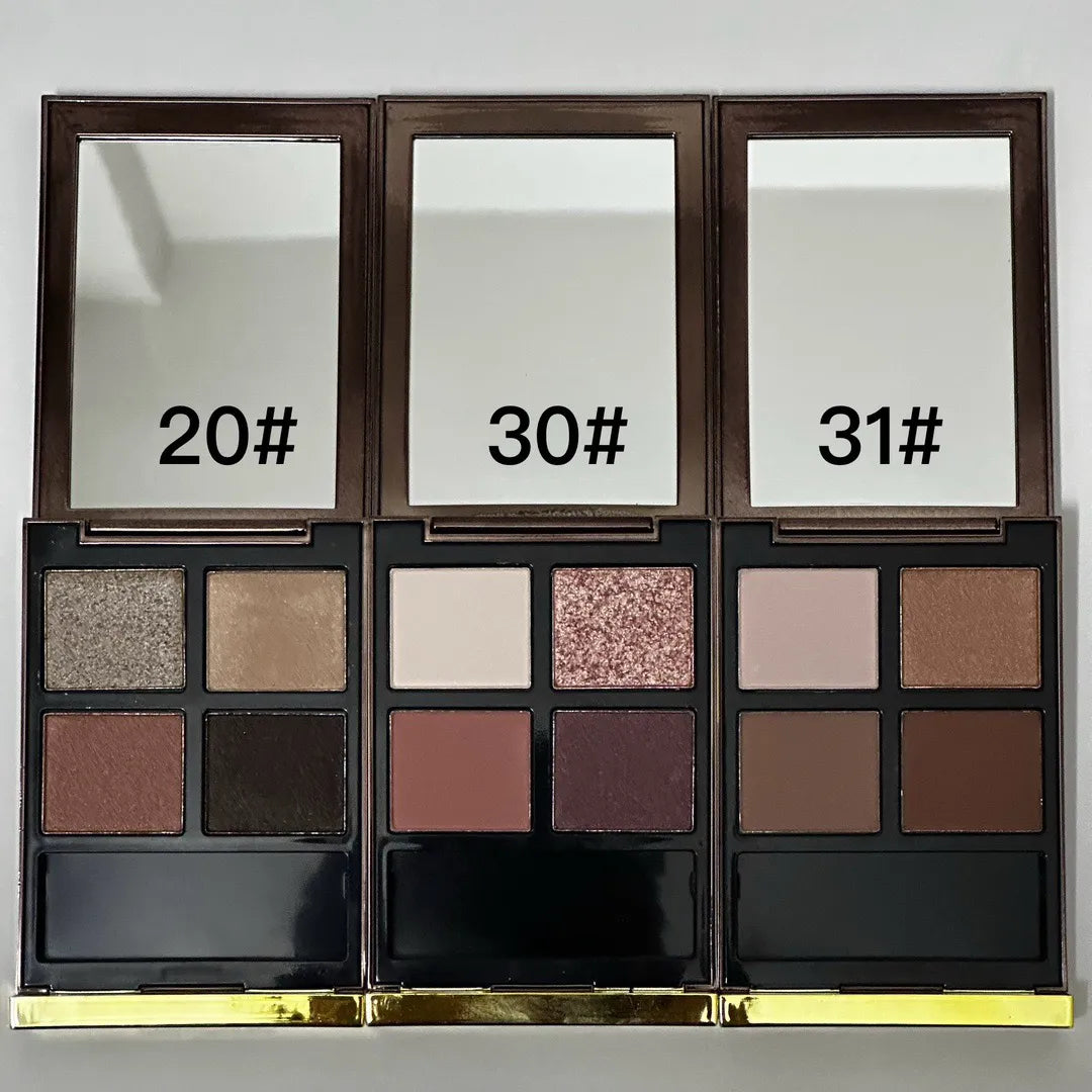 Four earth-tone eyeshadow shades in a compact palette