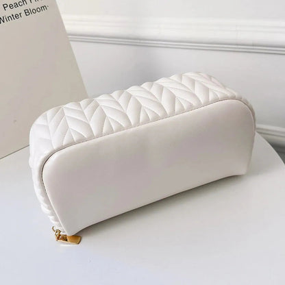 Front view of a PU cosmetic organizer bag with zipper closed