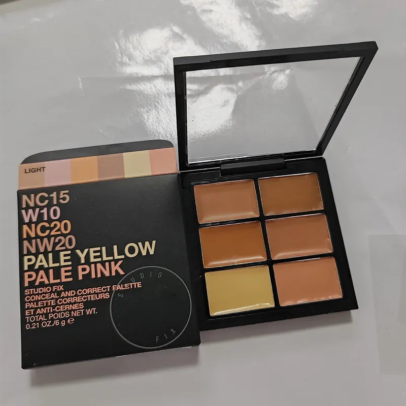 Open makeup palette showing six cream concealer shades arranged in two rows