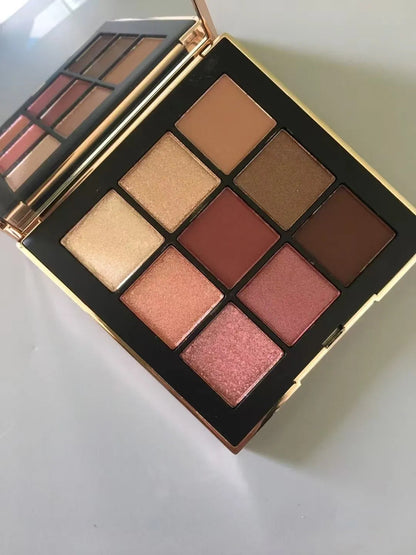 Close-up view of eyeshadow textures including glitter and matte shades