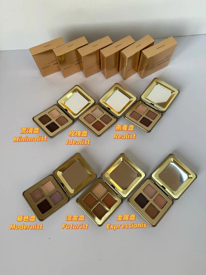 Eyeshadow palette open with four coordinated metallic shades displayed
